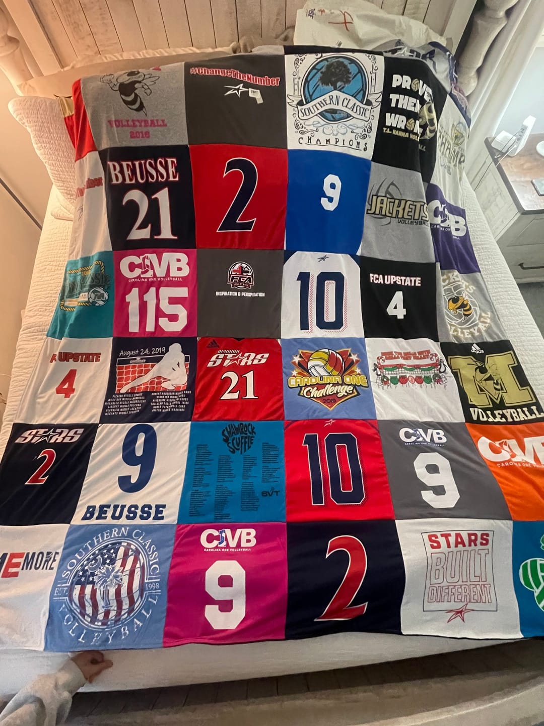 Colorful custom t-shirt memory quilt with vibrant school and activity shirts — Project Repat graduation gift